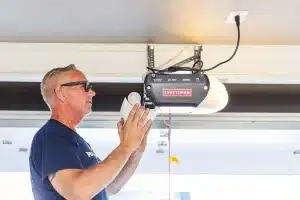 techinician configuring garage door opener