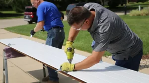 two experts working on garage door installation