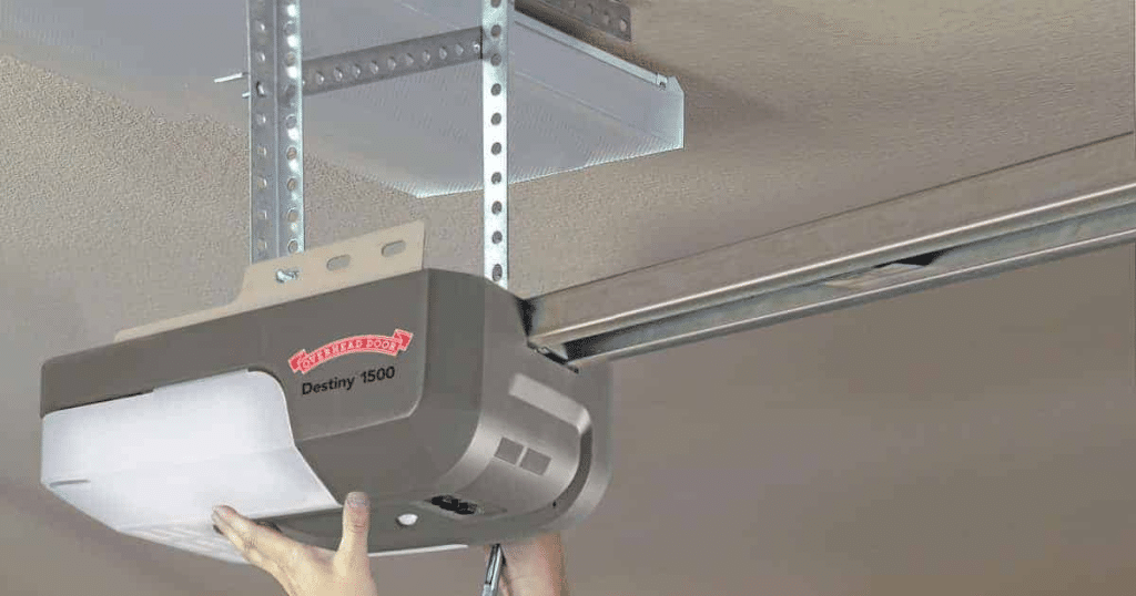 A person installing a garage door opener.